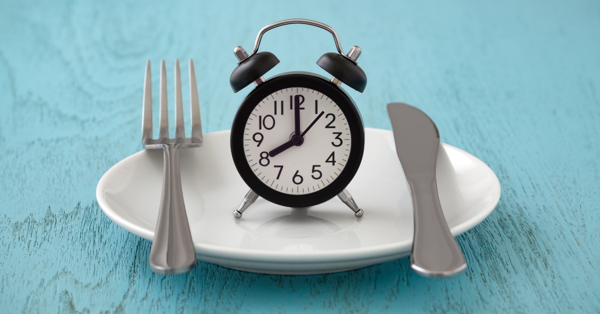 A fork & Butter-knife with an alarm clock